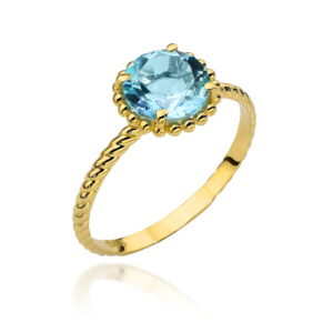 Pierścionek złoty z kolekcji "COLORFUL STONE" - topaz kółko i ozdobna szyna